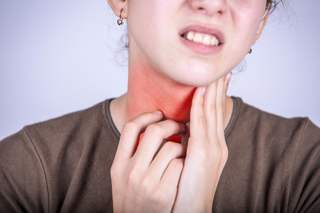 little girl with sore throat touching her necksore throat sicklittle girl having pain in her throat