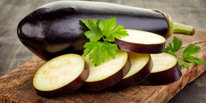 sliced eggplant on wooden cutting board