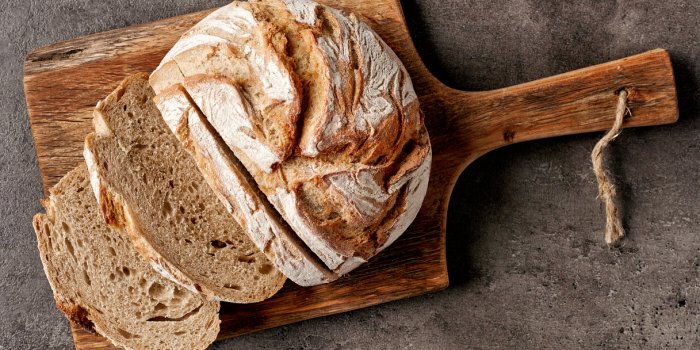 freshly baked bread on dark gray kitchen table, top view