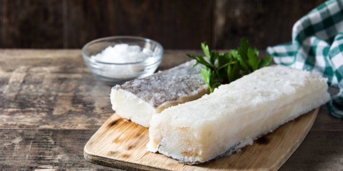salted dried cod on wooden table typical easter food