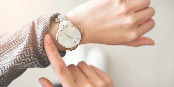 woman checking time her watch