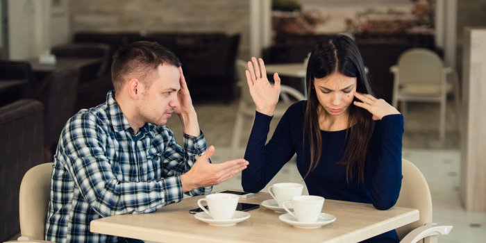 young couple arguing in a cafe relationship problems