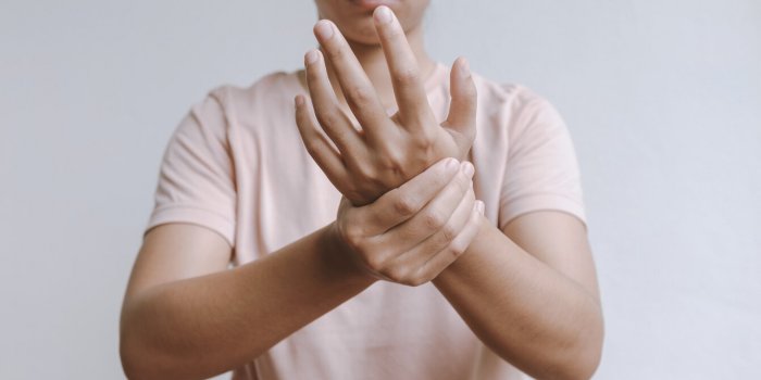woman hand massage physiotherapy other side is sore and numb, exhausted, tingling guillain-barre syndrome, a side effect ...