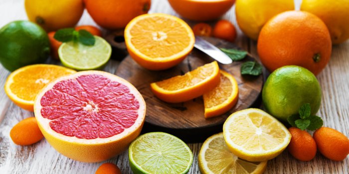 citrus fresh fruits on the white wooden table