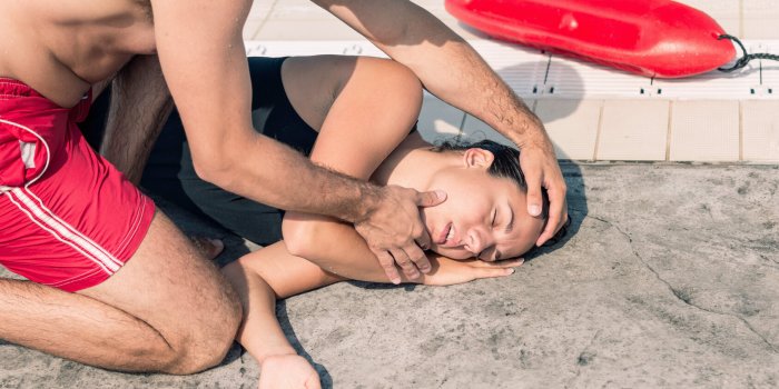 lifeguard rescue - positioning victim after swimming pool accident