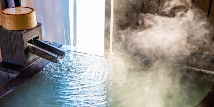 photo of a natural hot spring bath in a guest room with a hot spring