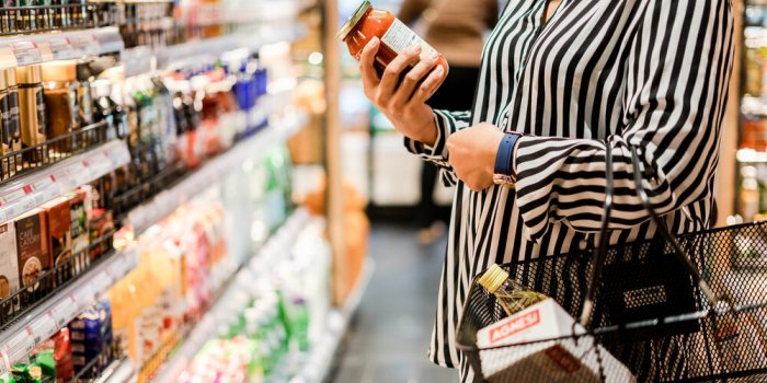 bangkok, thailand - august 5, 2019 woman chooses products in the supermarket, ready-made food, shopping