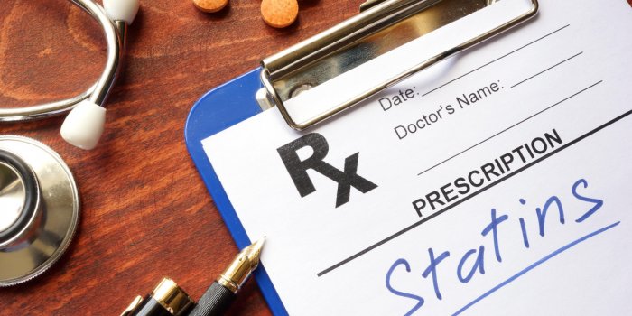 clipboard with written prescription statins and stethoscope