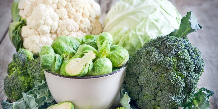 assortment of cabbages on old wood background