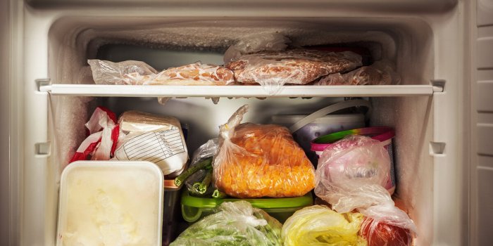 various frozen food in freezer, illuminated details