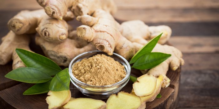 ginger root and ginger powder in the bowl