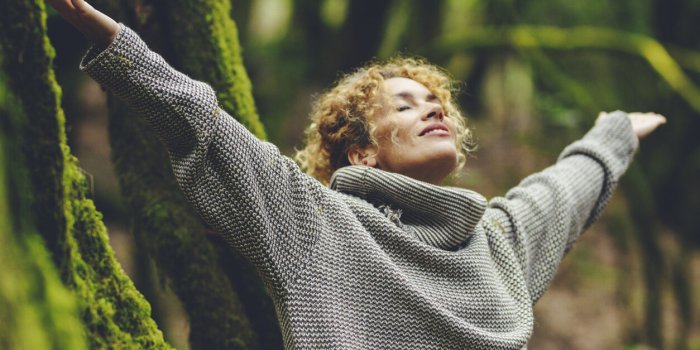happiness and nature wellbeing healthy people one woman smile and enjoy freedom in outdoor leisure activity celebrating p...
