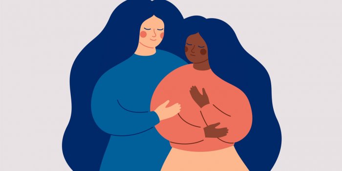 friends support concept a white woman comforts her best friend who in stress and depression a black girl is in a difficul...