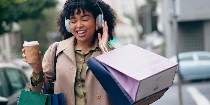 headphones, shopping bag or happy woman in city for boutique retail sale, or clothes discount deal coffee, financial free...