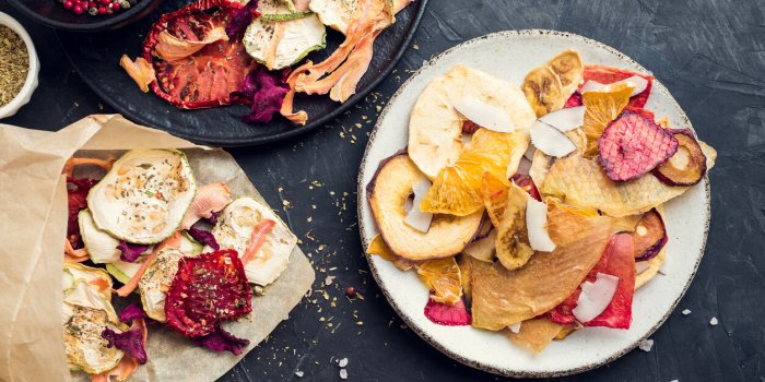 healthy homemade fruit and vegetable chips on dark background organic diet food the vegan diet dried vegetables vegetaria...