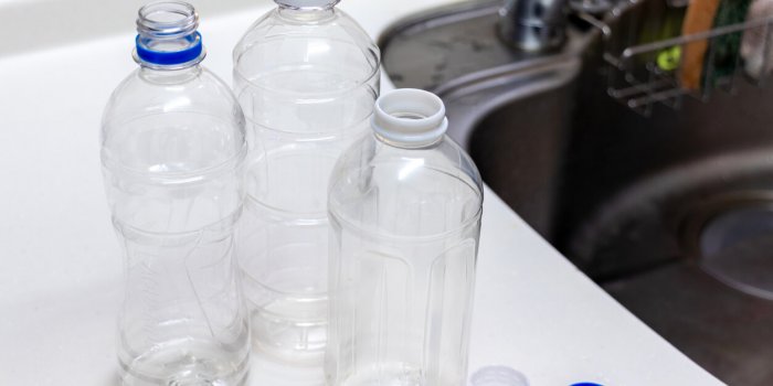 washing empty plastic bottles with water
