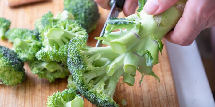 fresh green broccoli on a wooden cutting board macro photo green fresh vegetable broccoli