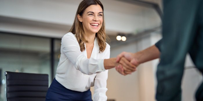 happy mid aged business woman manager handshaking greeting client in office smiling female executive making successful de...