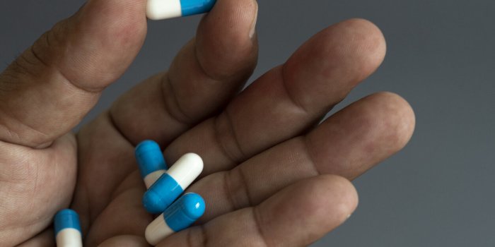 hand and medicine antiretroviral drug concept