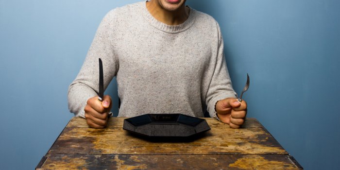 hungry young man is screaming for his dinner