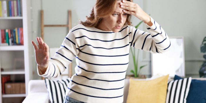 young woman suffering from vertigo or dizziness problem of brain or inner ear
