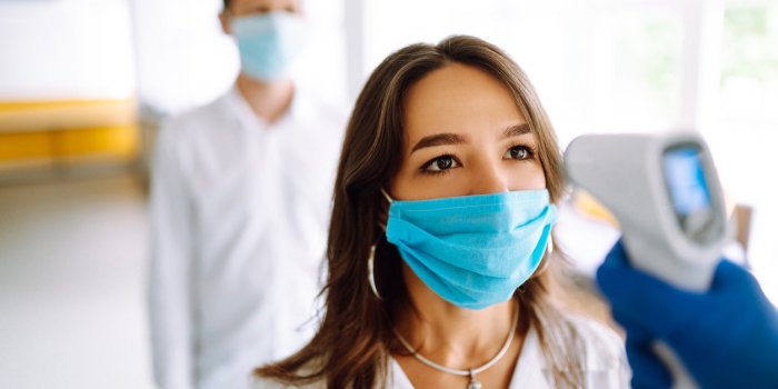 visitors must go through fever measures using infrared digital thermometer check temperature measurement on the forehead ...