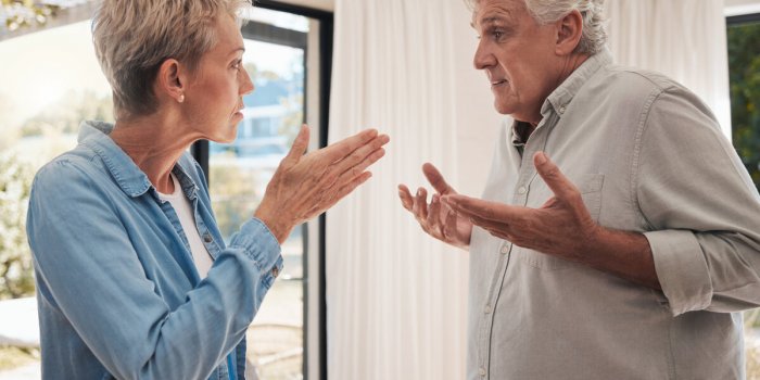 mature couple fight, divorce and conflict problem in conversation with anger, blame and stress at home angry woman, frust...