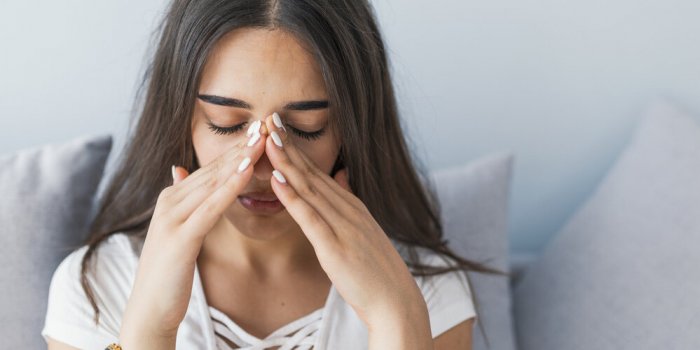 sinus ache causing very paintful headache unhealthy woman in pain sharp strong sore sinus pain, sinus pressure, sinusitis...