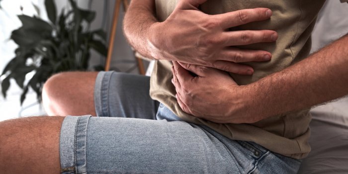 man with stomach pain and digestive issues