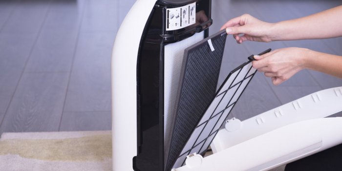 replacing air purifier dust and particle filter of a device in order to keep your home air clean of bacteria, pet hair or...
