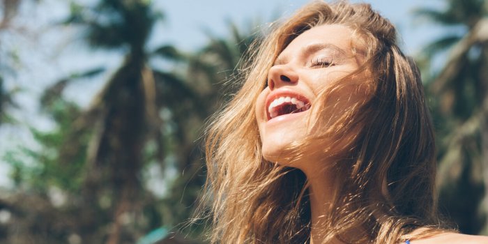 beauty sunshine girl portrait pretty happy woman enjoying summer outdoors sunny summer day under the hot sun on the beach