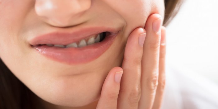 close-up of a woman having tooth problem